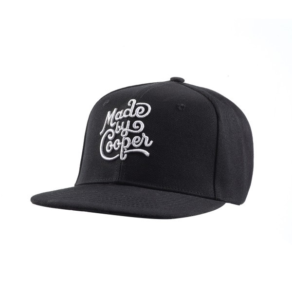 Custom baseball cap and custom snap back with bold embroidered Made by Cooper branding, highlighting quality stitching and modern flat-peak design.