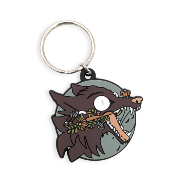 A custom PVC keyring featuring a cartoon werewolf with crazy eyes and his wild tongue hanging out of his mouth.